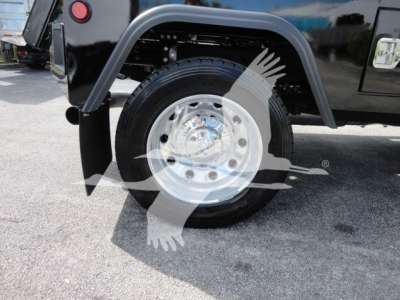 Ram 4500 truck wheel and fender showing chrome wheel and black body panel with fender flare.