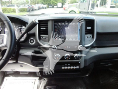 Ram truck interior showing center touchscreen infotainment system and dashboard controls.