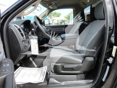 Ram 4500 SLT truck interior front seats and dashboard seen from open driver's side door with watermark overlay.