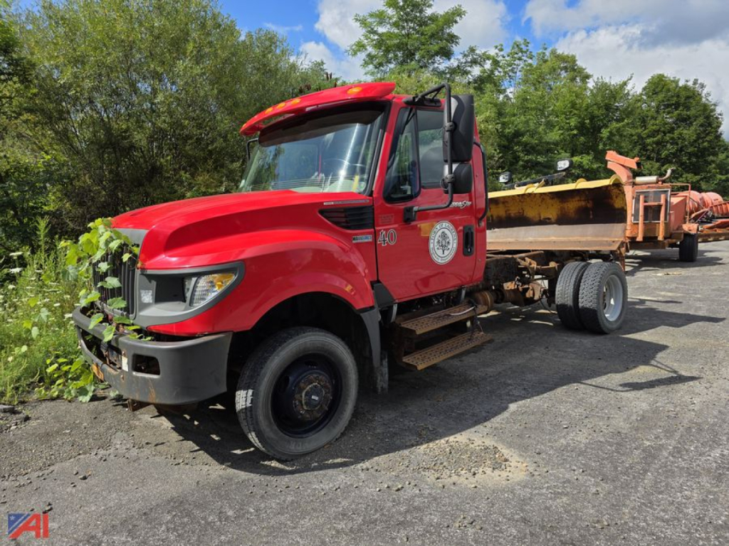 Red 2014 International TerraStar cab and chassis with plow showing front and side view and a dump/plow trailer in the bed.