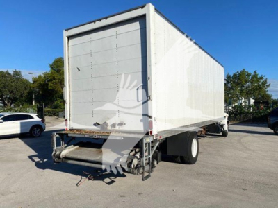 Box truck rear view showing cargo box and rear landing gear, with tailgate and dual rear wheels.