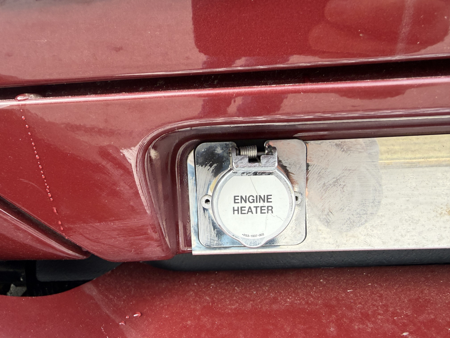 Kenworth T680 engine heater cap and surrounding rear bumper area