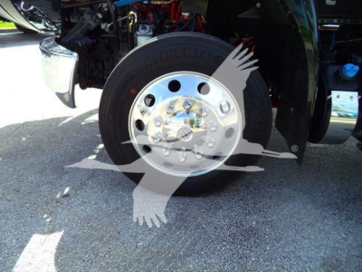 Wheel close-up on a new 2027 International MV rollback truck showing a Continental wheel with chrome hub and lug nuts.
