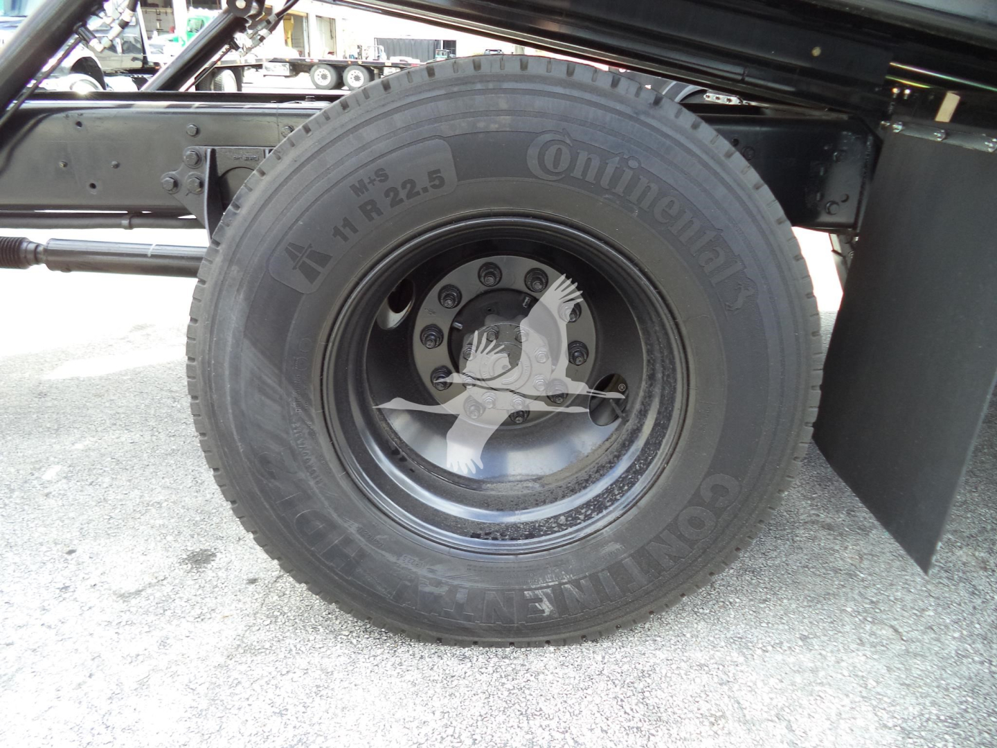 Truck wheel close-up showing Continental tire and wheel assembly (no text other than tire brand visible in image).