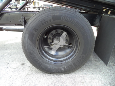 Truck wheel close-up showing Continental tire and wheel assembly (no text other than tire brand visible in image).