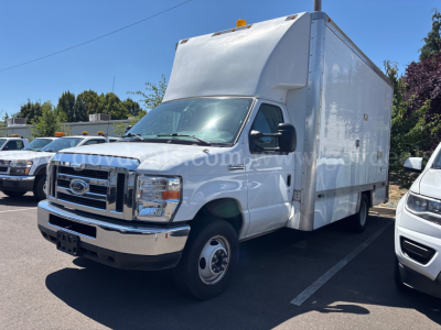 Ford Econoline box truck in a parking lot showing front and side with large cargo box, VIN 1FDXE4FS1HDC20652