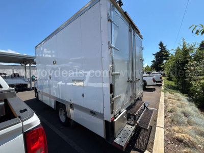 Box truck rear showing dual rear doors and platform step, Ford Econoline box truck, white exterior, VIN 1FDXE4FS1HDC20652.