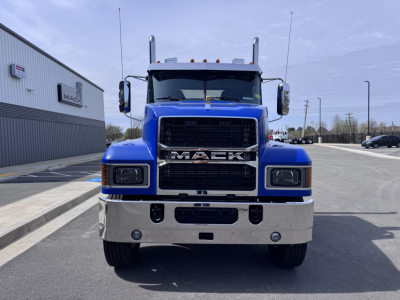 Front view of a blue 2027 Mack PI64T conventional daycab truck showing large chrome grille with MACK badge, rectangular headlights, and chrome bumper.