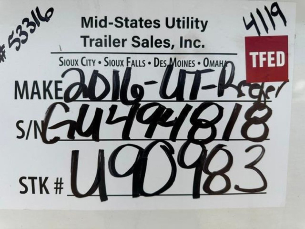 Trailer tag showing Make 2016-UT-Reefer, S/N G494818, STK # U90983, TFED label, mid-states utility trailer sales sticker.