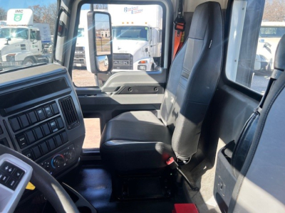 Vehicle cab interior of a used 2022 Mack AN42T showing driver seat and passenger seat with dashboard and controls visible.