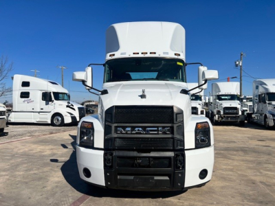 Front view of a white 2022 Mack AN42T daycab truck with large grille, bumper, and cab mirrors visible.