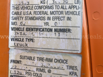 Truck VIN plate showing Vehicle Identification Number 2FZAAZCV95AU91423 and vehicle type truck; labeled tires and rims information and weight details.