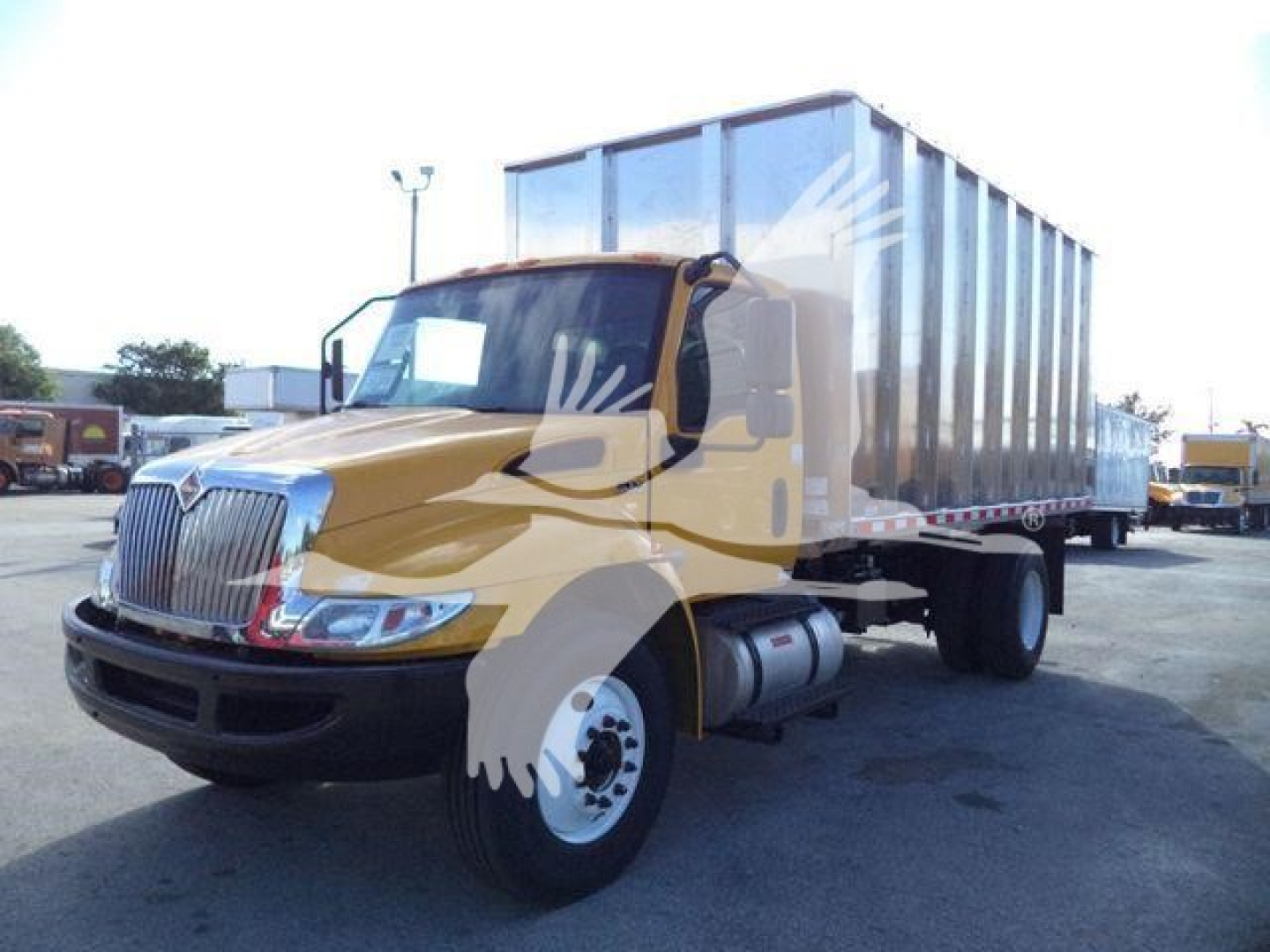 2019 International 4300 truck with a large dump body, yellow cab, front grille visible, side view showing dual rear wheels.