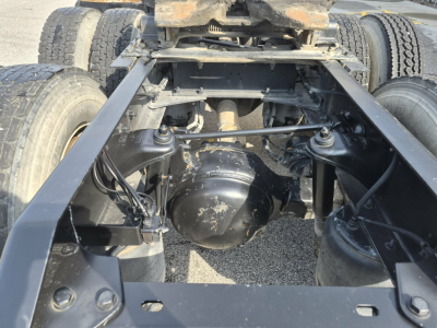 Kenworth T880 chassis with rear axle and suspension visible, showing differential housing and frame rails.