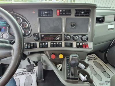 Kenworth T880 dash and gear shifter view showing dashboard controls and center console.