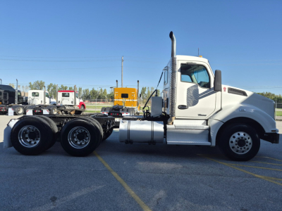Kenworth T880 conventional daycab truck side profile showing cab and chassis with dual rear axles.