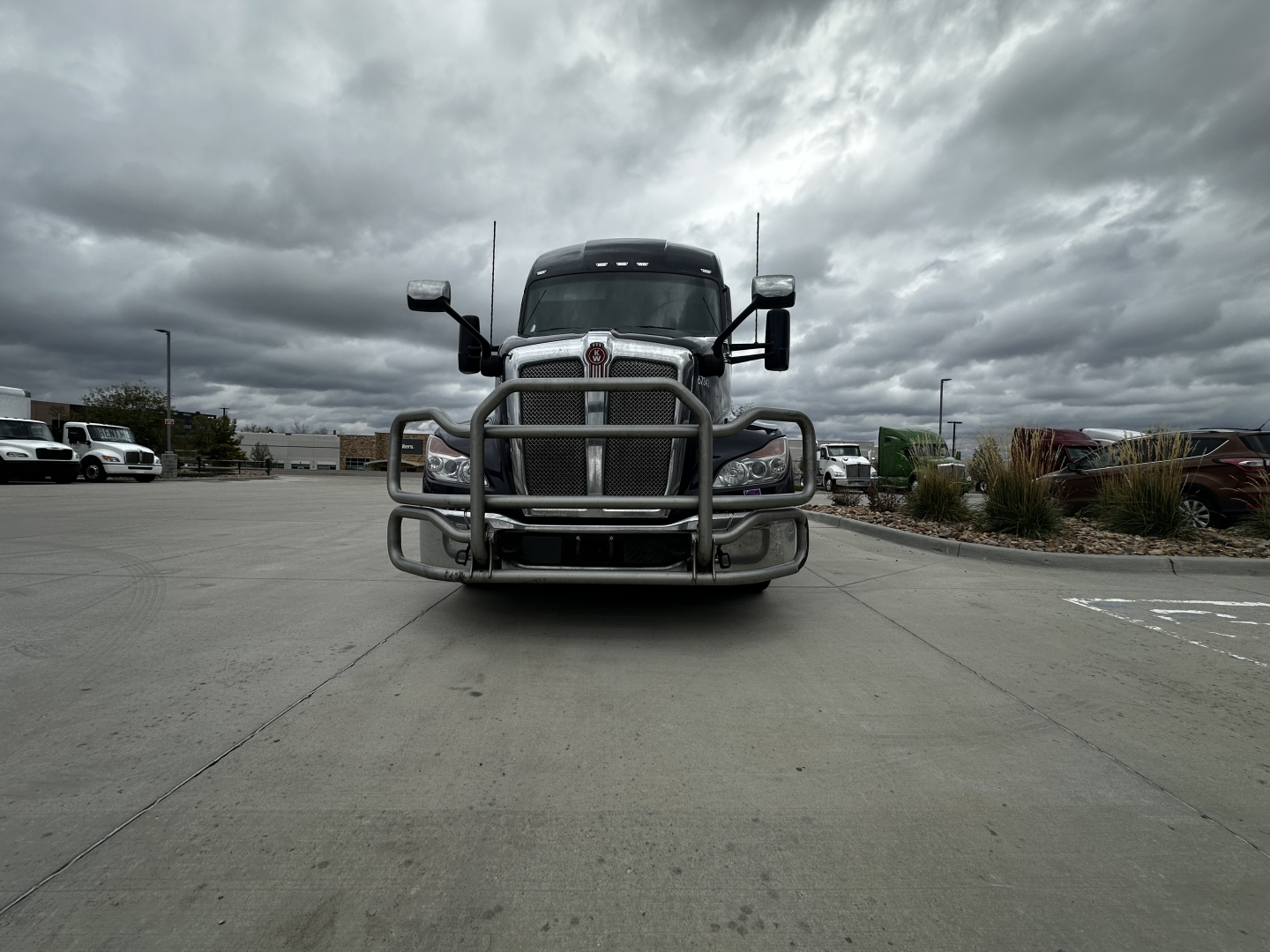 Kenworth T680 truck front view with grille guard, showing bumper and headlights.