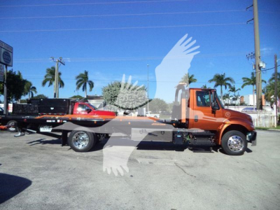 2019 International 4300 rollback truck side view showing wheelbase and flatbed