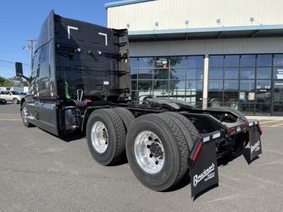 Mack PR64T64M conventional sleeper truck rear view showing dual rear axles and fifth wheel area
