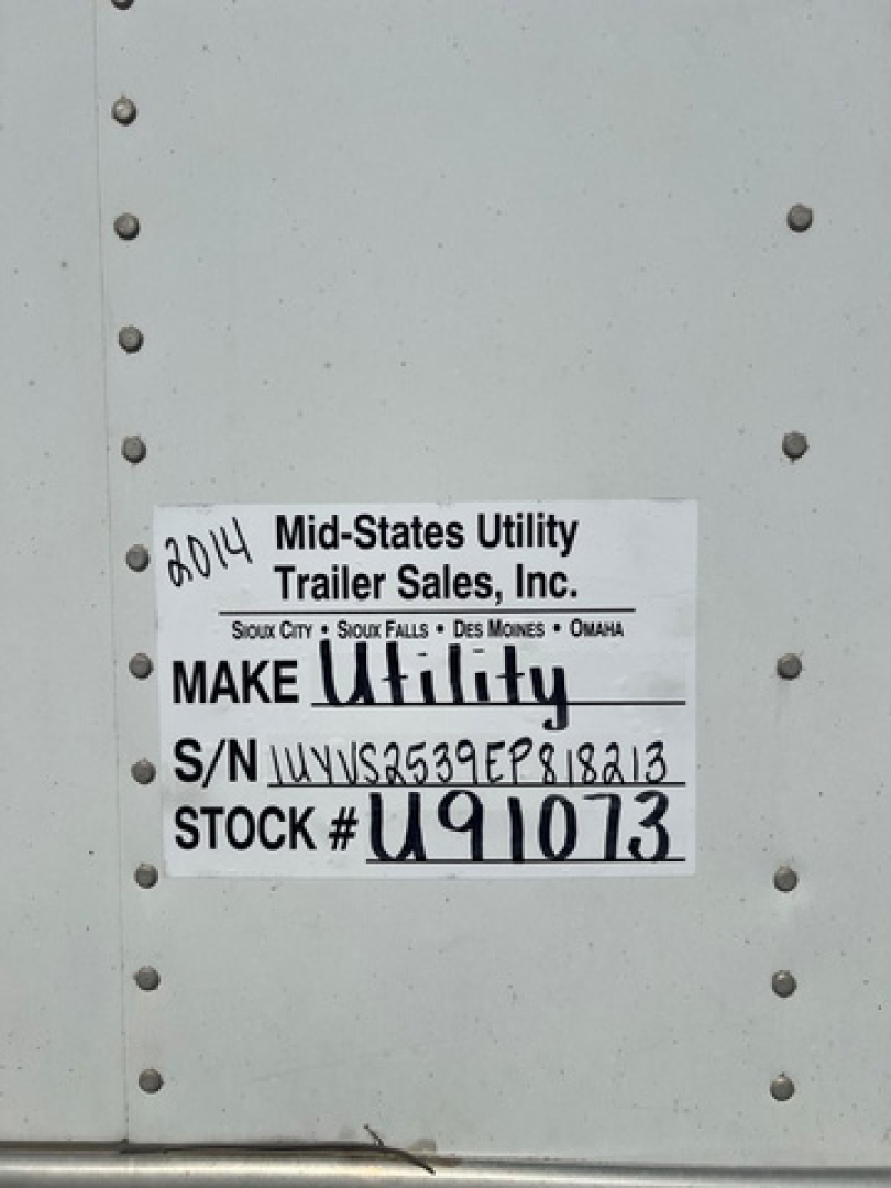 ID plate on utility van side showing Make Utility and S/N U91073 with VIN 1UYVS2539EP818213 and stock number U91073.