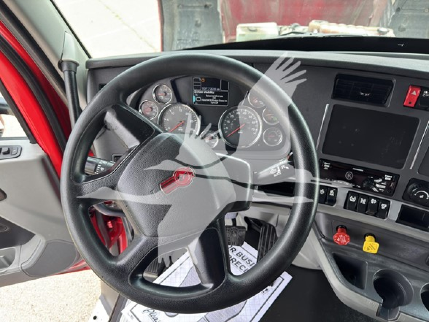 Kenworth T680 dashboard and steering wheel showing gauge cluster and center console.