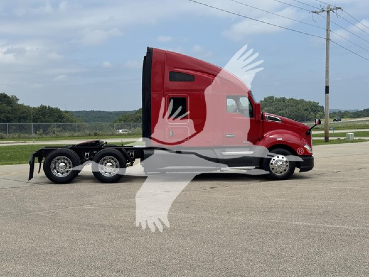 Kenworth T680 truck cab side profile showing sleeper with badge, red paint, tandem rear axles, curb wheels, highway setting.