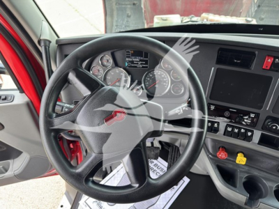 Kenworth T680 dashboard and steering wheel showing gauge cluster and center console.