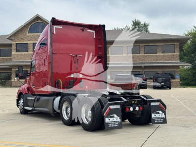 Kenworth T680 tractor rear/side view showing red sleeper cab, dual rear axles, and rear mud flaps with Kordell logos.