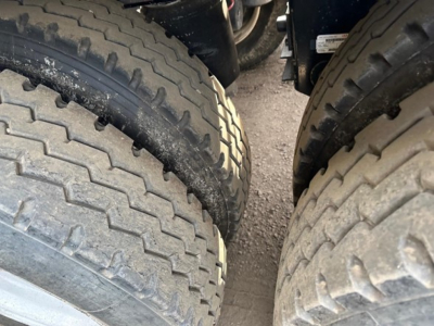 Trailer tire tread close-up view for 2025 Jet Air Ride Side Dump showing dual rear tires and wheel surfaces.