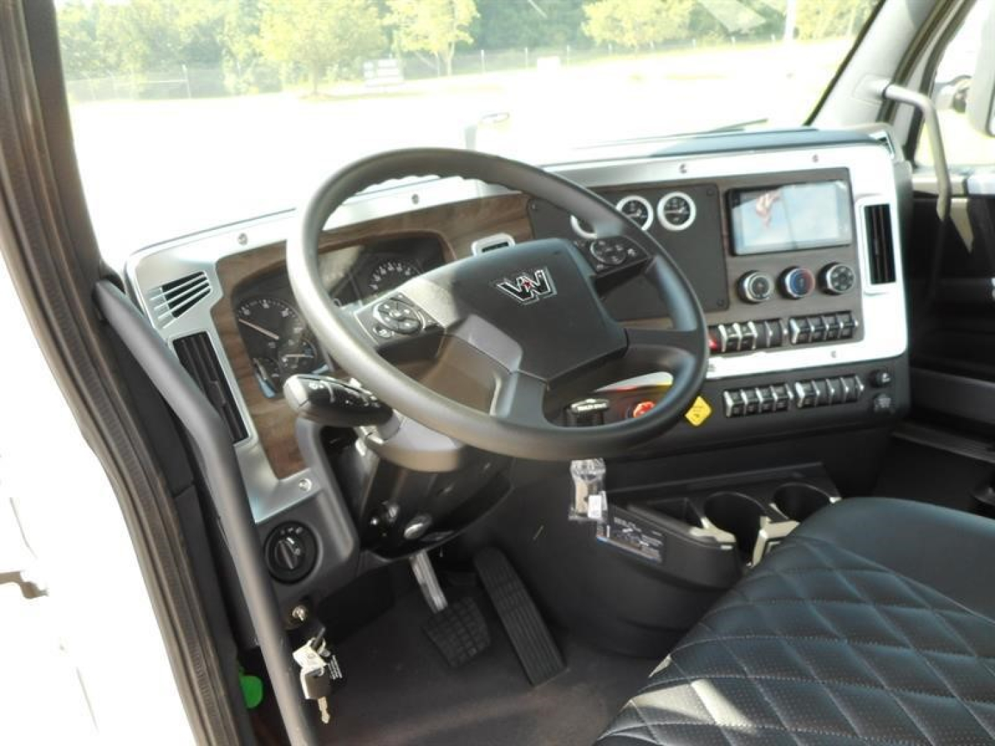 Western Star 49X interior dashboard and steering wheel with digital display and controls