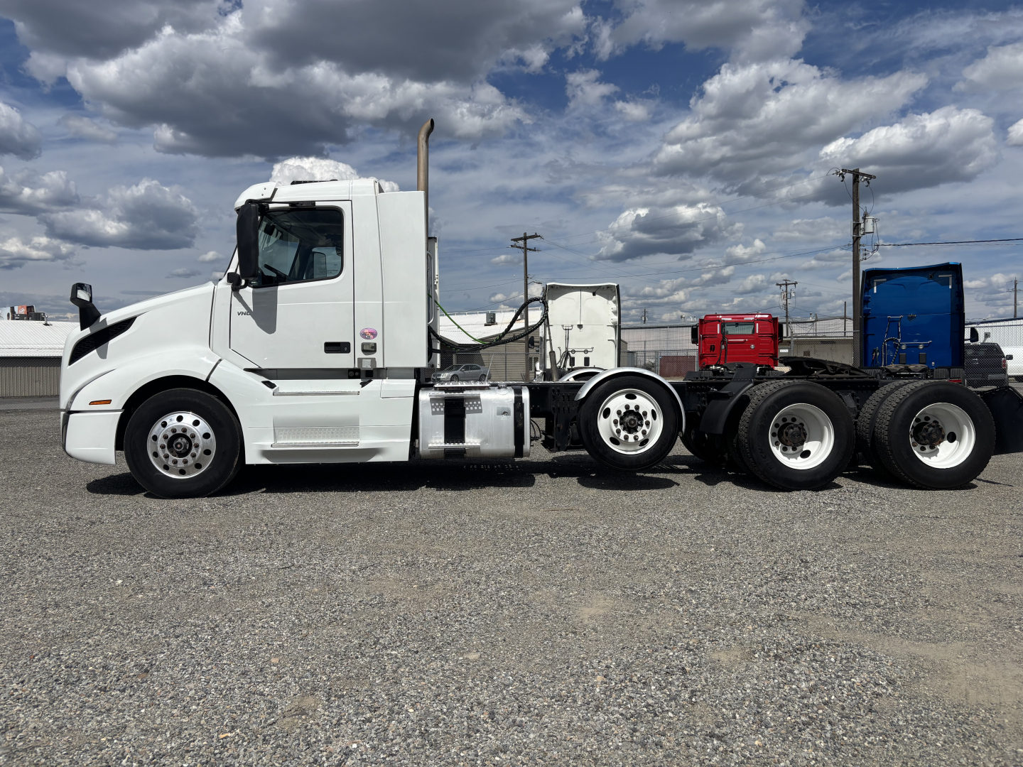 Volvo VNL84T300 conventional daycab tractor in profile showing cab, exhaust stack, and dual rear axle configuration.