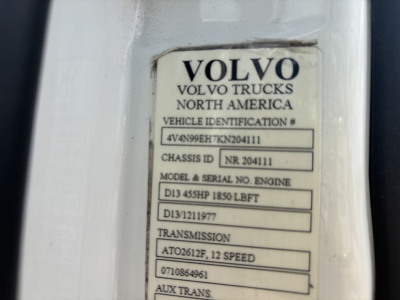Volvo Trucks identification plate showing VIN, chassis ID, model & serial, engine, and transmission details.