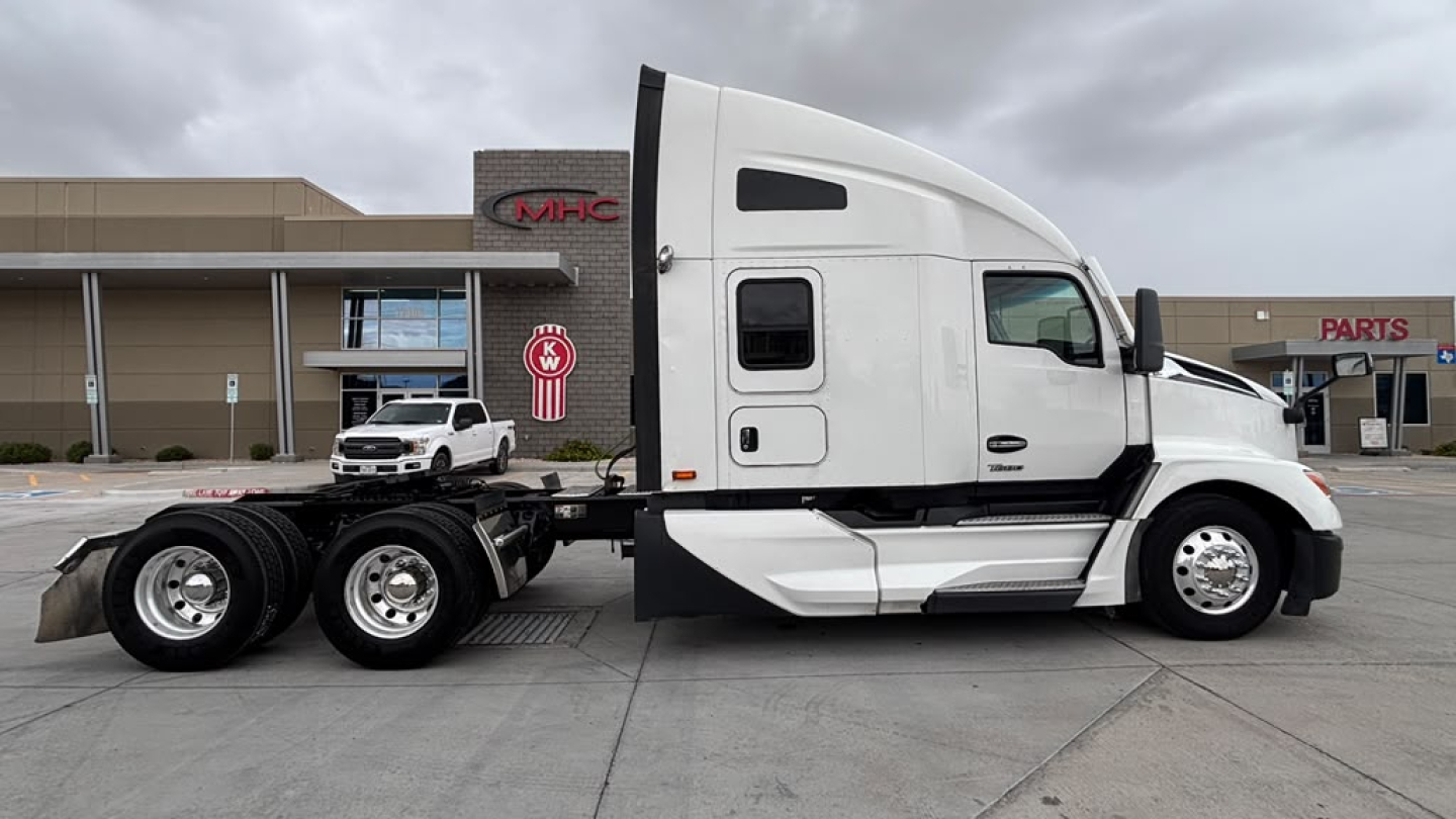 Kenworth T680 tractor with sleeper cab side view showing chassis and 6-wheel rear axles.