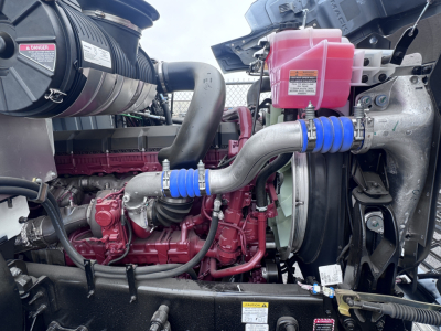 PI64 engine bay showing turbo, pink coolant reservoir, blue silicone hoses, and red engine block.