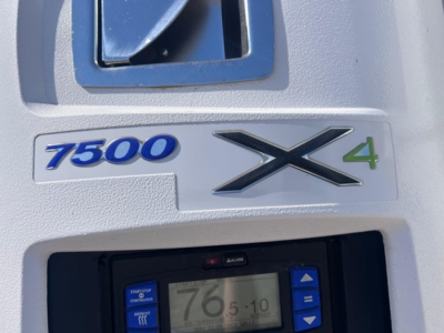 Rear quarter of a 2022 Utility 3000R trailer showing 7500 X4 badge and model graphics.