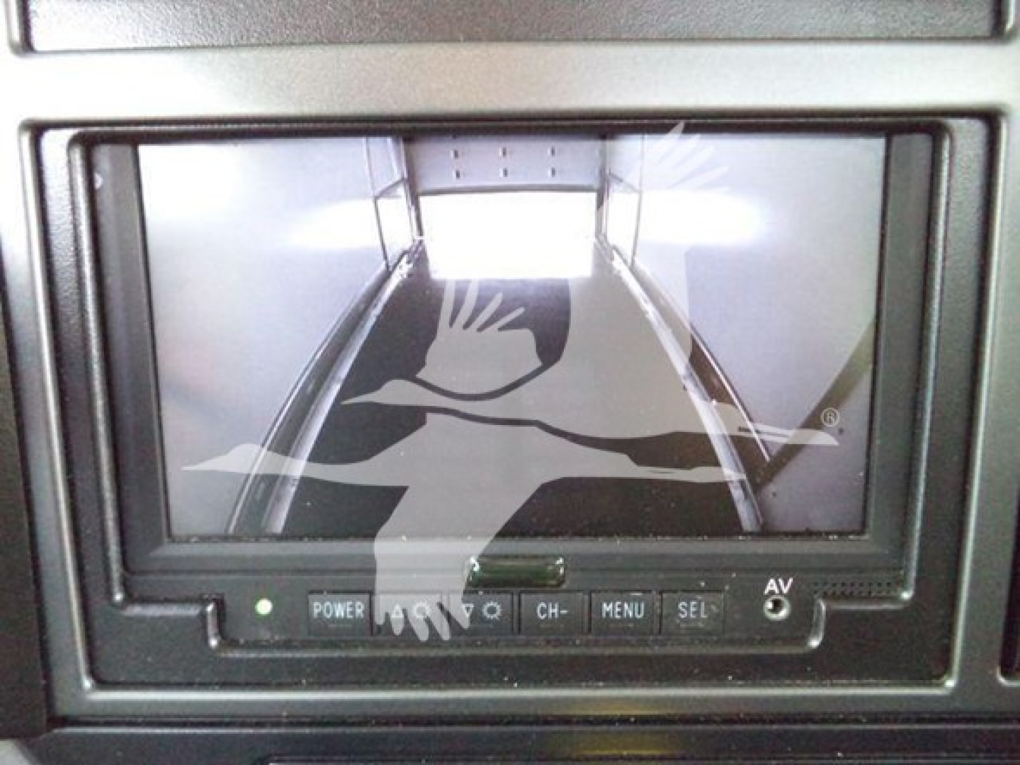 Mack MD6 cab interior display screen and controls showing rear view camera image.