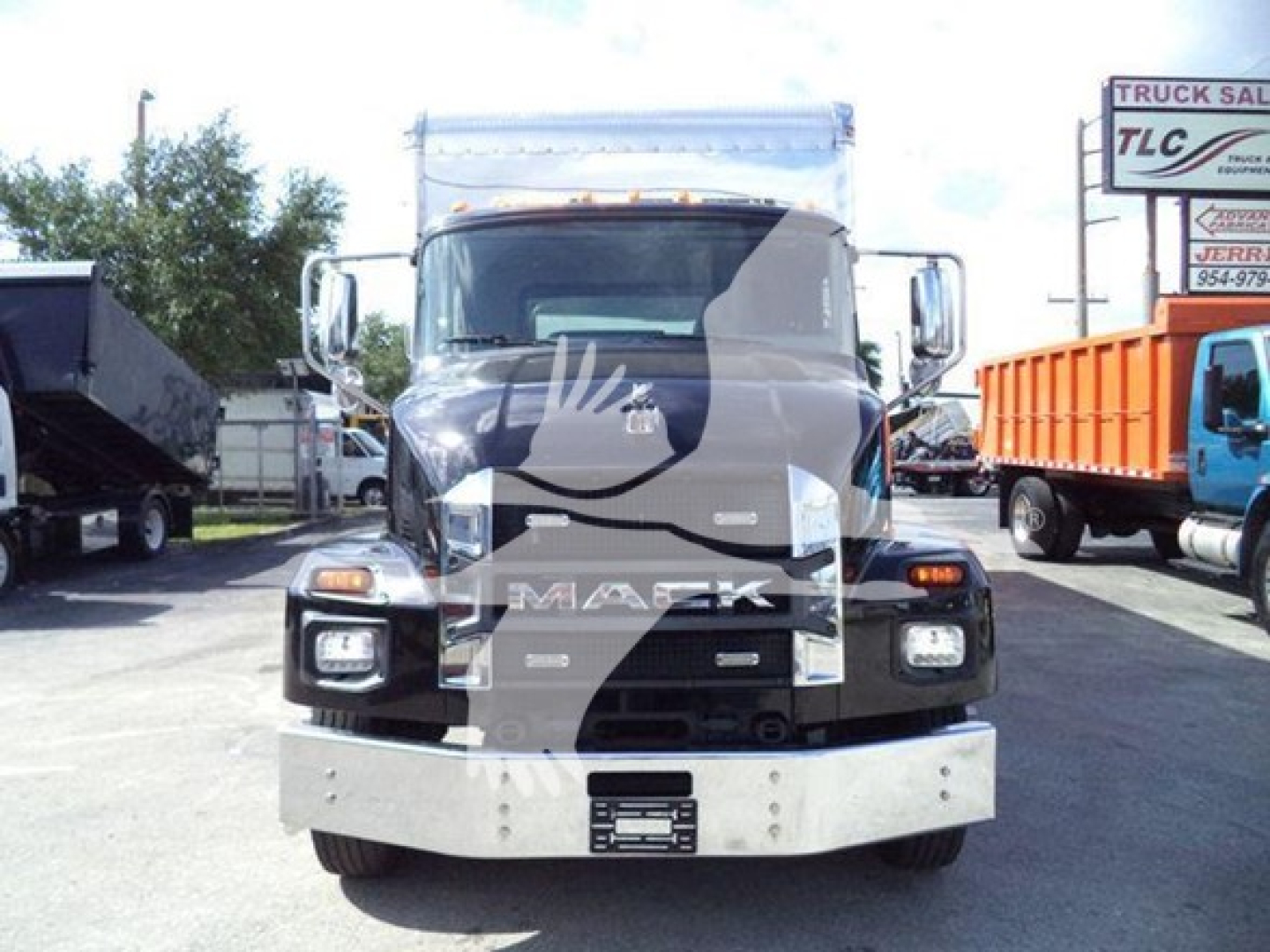 Front view of a 2022 Mack MD6 truck in a used inventory lot showing the Mack grille and bumper.