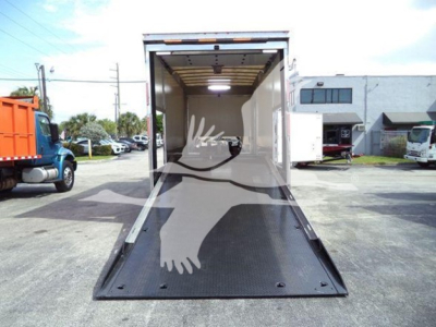 MD6 Mack rollback truck interior with open cargo ramp showing loading area and rear entry.