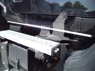 MD6 truck side view showing step/footboard and fuel/maintenance box near cab with chrome trim.