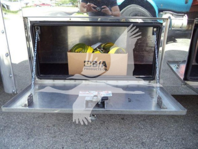Mack MD6 truck equipment storage compartment showing open rear toolbox with chains and yellow safety gear in box