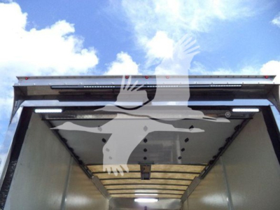 Mack MD6 rollback truck bed interior view with open rear doors.