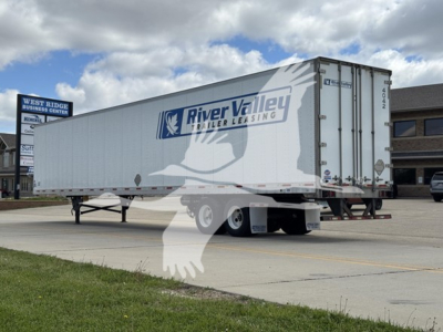 Utility trailer showing River Valley Leasing logo on side with tandem axles and rear doors in a parking lot.