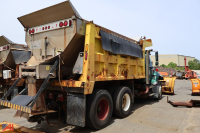 Dump truck rear view showing International WorkStar 7400 chassis with yellowDump body