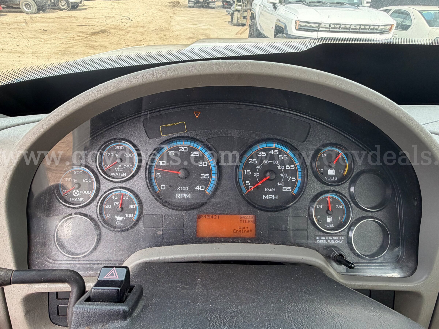 Dashboard view of a 2014 International TerraStar SFA 4x2 showing instrument gauges including RPM, speedometer, and warning lights with orange display in center.