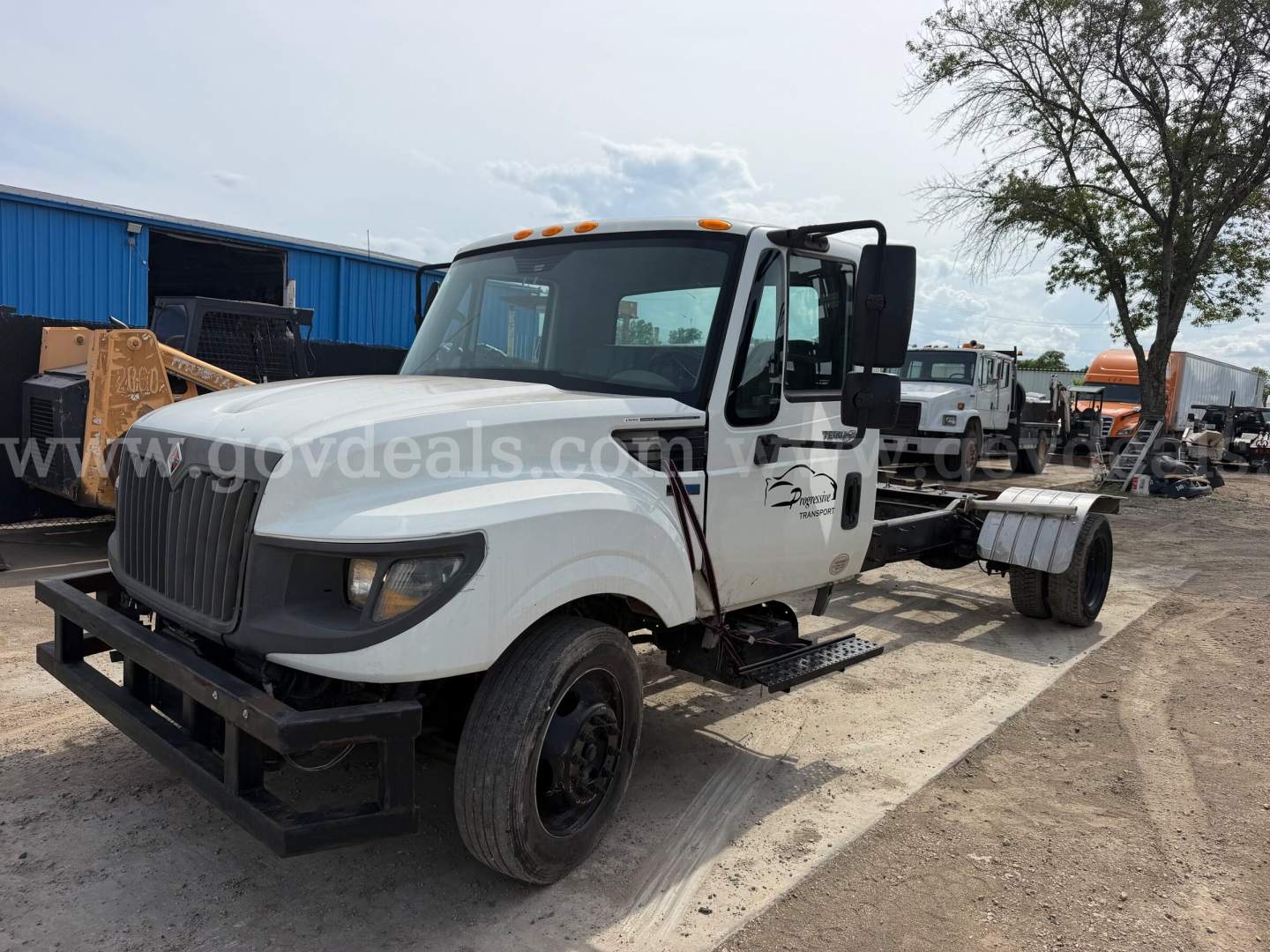 International TerraStar SFA 4x2 dump truck showing front and driver side with white cab and black chassis.