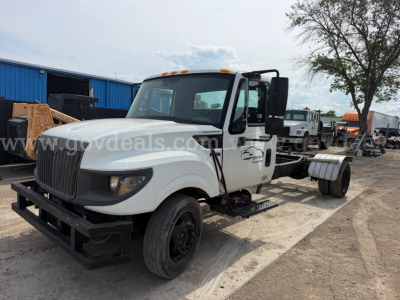 International TerraStar SFA 4x2 dump truck showing front and driver side with white cab and black chassis.