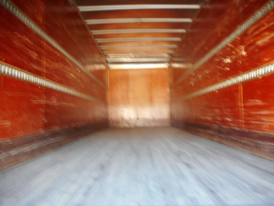 Freightliner M2 106 truck interior empty boxbed showing metal ribs along walls and wooden end panel