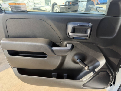 Chevrolet 6500 HD truck interior door panel with manual window crank and door handle