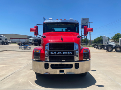 Front view of a red 2021 Mack AN64T conventional daycab truck showing grille with 'MACK' badge and chrome bumper.