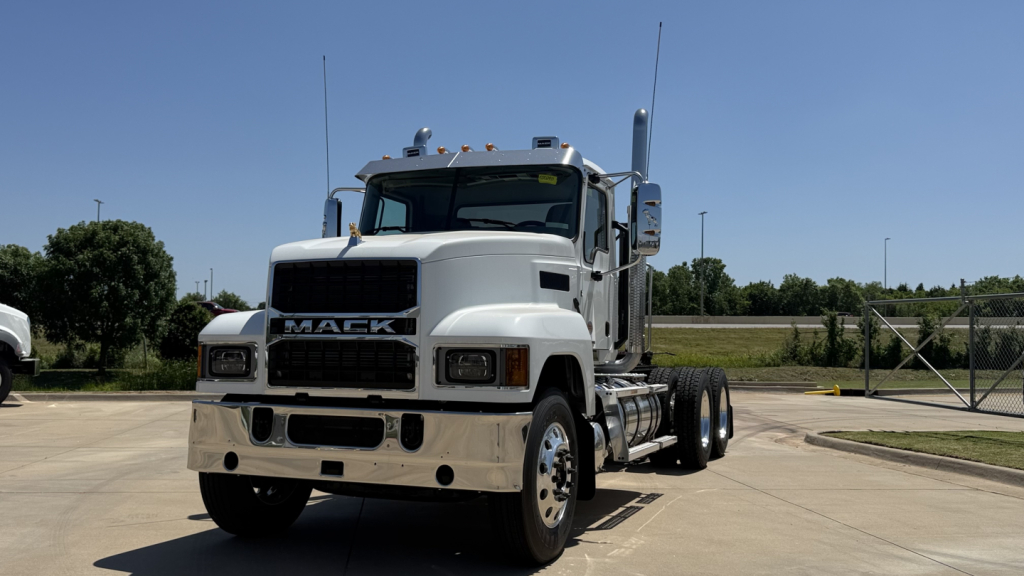 Mack PI64T tractor truck front view showing large grille and dual exhaust stacks.